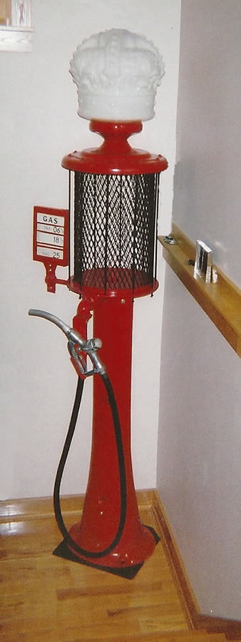 Red powder coating on an antique gas station pump